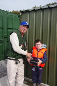 Luke collecting a prize for heaviest rainbow from Tom Connolly